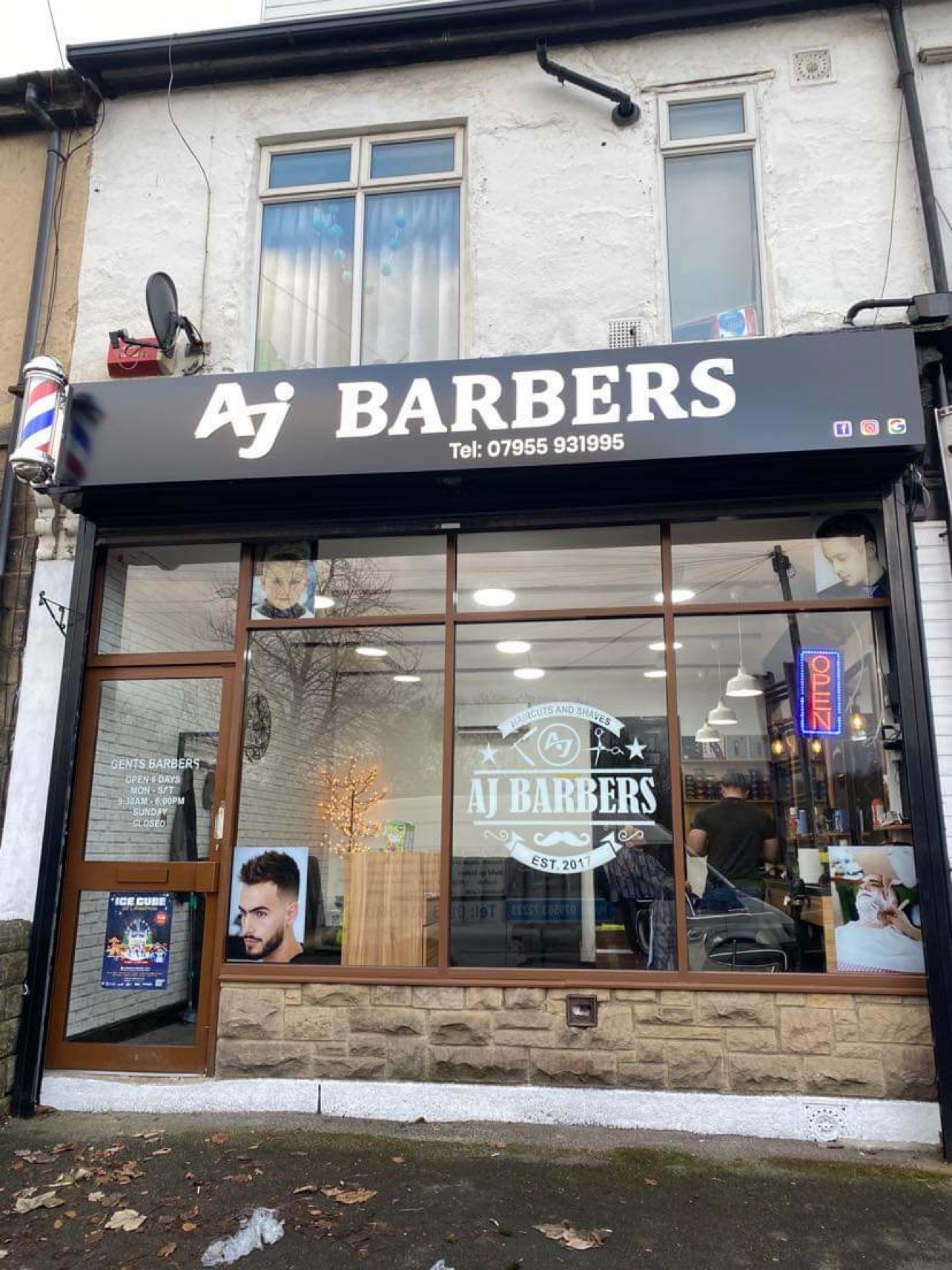 The AJ Barbers shopfront and entrance at 338 Low Lane in Horsforth